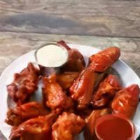 Buffalo Wings · 12 piece bone-in wings fried then dunked in your choice of sauce.