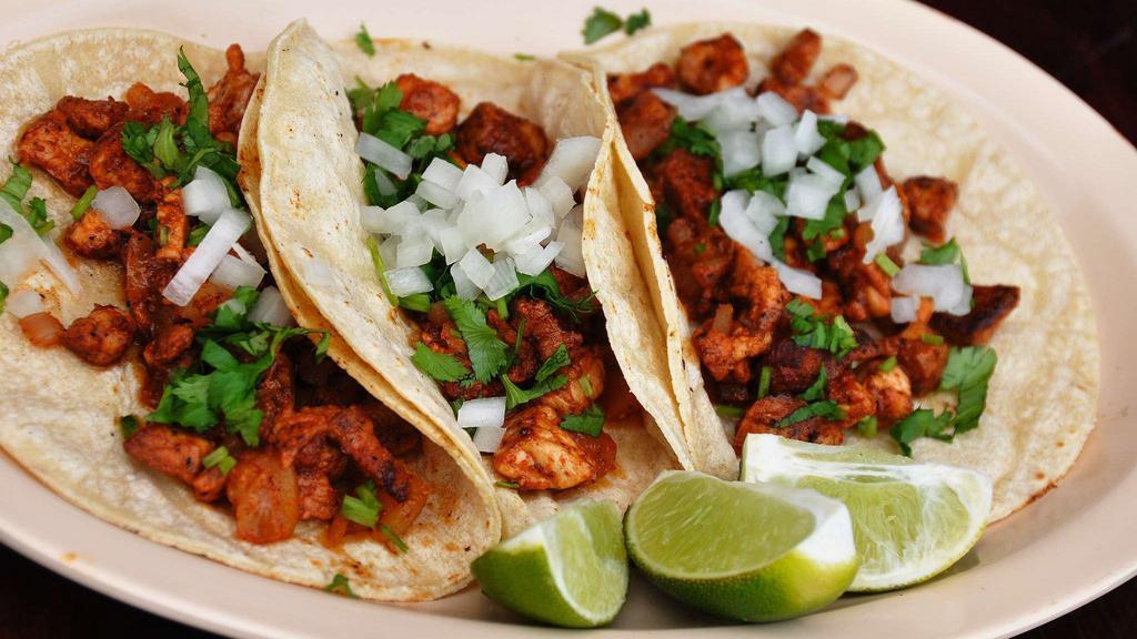 Al Pastor Taco · All tacos are served on fresh soft corn tortillas, garnished with fresh chopped cilantro, onions, and limes.
