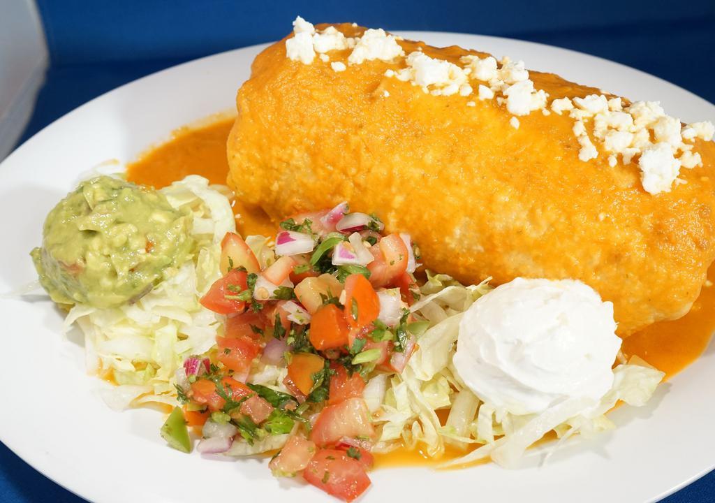 Chimichanga · Flour tortilla stuffed with choice of meat, mozzarella, refried pinto beans and mexican rice, fried to golden, topped with mozzarella and ranchero sauce, with lettuce, sour cream, guacamole and pico de gallo.