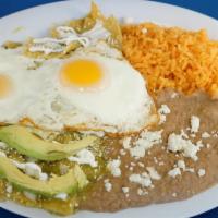 Chilaquiles · Tortilla chips soaked in our house made red or green salsa and topped with two eggs, sour cr...
