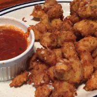 Cheese Curds · House battered Ellsworth creamery white cheddar cheese curds, served with marinara sauce.
