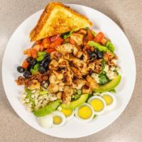 Cobb Salad · Grilled chicken, avocado, hard boiled legs, bacon, black olives tomato & bleu cheese crumble...