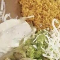 Enchiladas Mexicanas · Three enchiladas, one chicken enchilada topped with green sauce, one beef enchilada topped w...