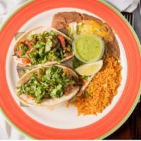 Baja Tacos · Two soft tacos with grilled steak, onions, jalapenos, bacon, pico de gallo, and fresh choppe...