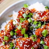 Sesame Chicken · Spicy. Battered chicken chunks, fried and glazed with our own spicy honey sauce, topped with...