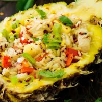 Tropical Fried Rice · A rich blend of fresh pineapple, raisins, cashews, and onions combined with chicken, shrimp,...