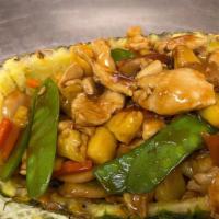 Pineapple Chicken · Sliced chicken with sugar snap peas, carrots, water chestnuts, and fresh pineapple chunks se...