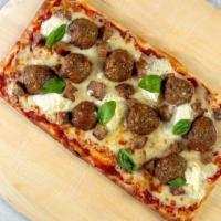Italian Meat-Lovers Flatbread · Stone-fired flatbread with a rich Marinara sauce base, topped with mozzarella cheese, meatba...