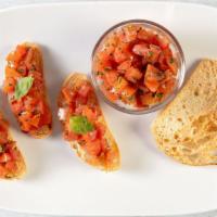 Bruschetta · Ciabatta crostinis, topped with tomatoes, garlic, fresh basil and olive oil.