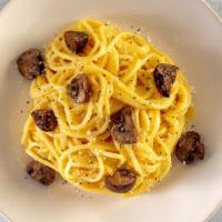 Spaghetti Cacio E Pepe With Truffle-Infused Mushrooms · Spaghetti in a peppered cheese sauce, Truffle-infused roasted Cremini mushrooms, topped with...