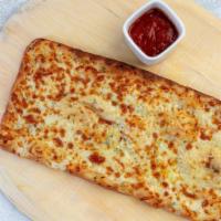 Garlic Cheese Flatbread · Stone-fired cheese flatbread with garlic, butter and herbs, served with Marinara sauce on th...