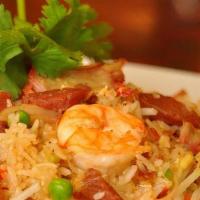 Fried Rice · Stir fried with egg, bean sprouts, carrots, green peas, topped with cilantro.