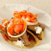 Gyro · Gyro meat on toasted pita. Served with tzatziki sauce, tomato, onion, and gyros meat seared ...