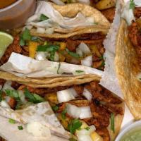 Taco Dinner Al Pastor  · Four (4) corn tacos al pastor with pineapple  with cilantro and onions served with rice  and...