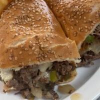 Philly Steak & Cheese Sub Deluxe · Swiss green peppers, onions.