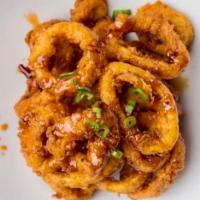 Fried Calamari · Calamari lightly battered and fried with a sweet chili cocktail sauce and spicy mayo.