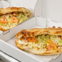 Veggie Calzone · Mushrooms, onions, green peppers, mild peppers, lettuce, tomato, cheese, mayo and Italian dr...
