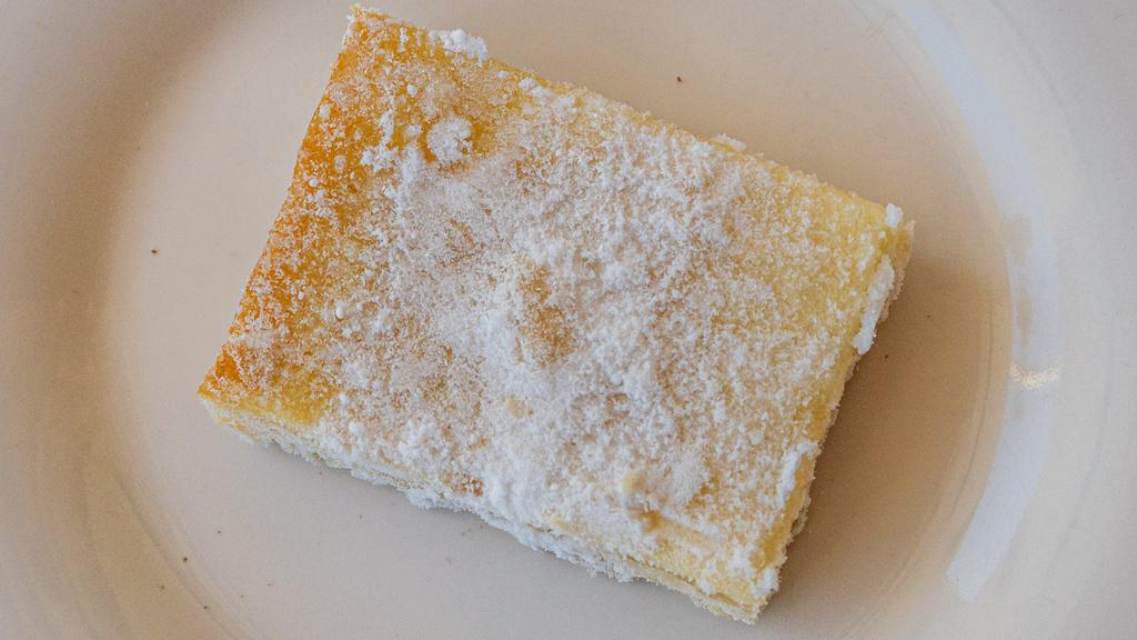 Sugar Free Lemon Bar · Same great look and flavor as our original Lemon Bar without the sugar.  Great for those with dietary restrictions who cannot consume sugar. Sometimes when making delicate products free of preservatives and stabilizers, shipping can be a challenge. For that reason, this product is currently only available by the dozen. Ingredients: untreated wheat flour, maltitol, whole eggs, butter, water, citric acid, lemon extract, baking powder.