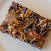 Gluten Free Caramel Brownie · Rich, gluten-free chocolate brownie batter topped with caramel and semi-sweet chocolate chip...