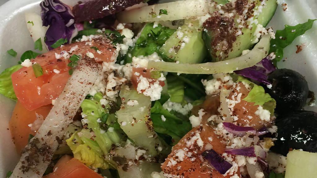 #04 Greek Salad · House salad, black olives, feta & beets.