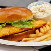 Fish Sandwich Deluxe · Crispy delicate flounder fillet on a brioche bun topped with lettuce and tartar sauce. Serve...