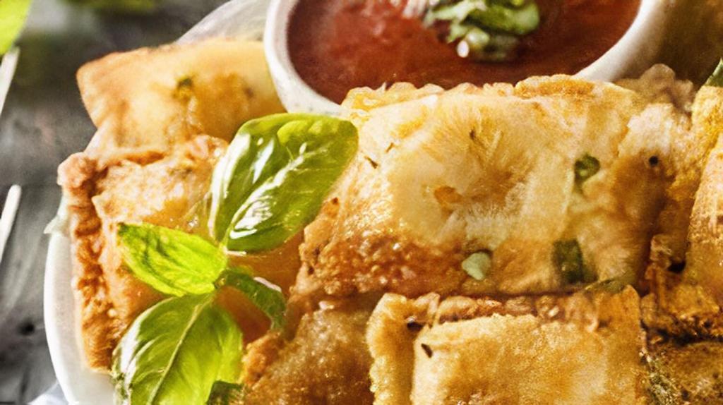 Fried Ravioli (8Pc) · Ravioli stuffed with cheese or meat then breaded. served with parmesan and homemade marinara.