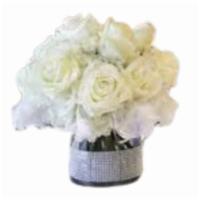 Silver White Centerpieace · Beautiful winter white hydrangea, asiatic lilies, carnations and greens surround three exqui...