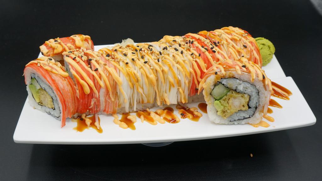Omg Roll · Spicy shrimp tempura, avocado, and cucumber topped with crab, boss sauce, eel sauce and sesame seeds.