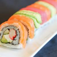 Rainbow Roll · Crabstick, cucumber, Avocado, cream cheese topped with Tuna, Salmon and Avocado.