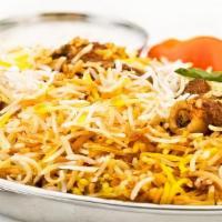 Goat Biryani · Boneless Goat meat cooked with Basmati rice, herbs and spices