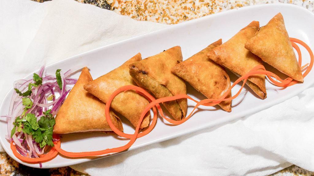 Samosa (2) · Fried pastry with a savory filling of spiced potatoes, onions and peas