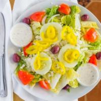 Greek Salad · Lettuce greens with tomatoes, cucumbers, banana peppers, Kalamata olives, feta cheese and on...