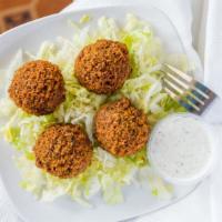 4 Piece Falafel · Spicy, seasoned ground chickpeas blended with fresh herbs and Mediterranean spices, fried to...