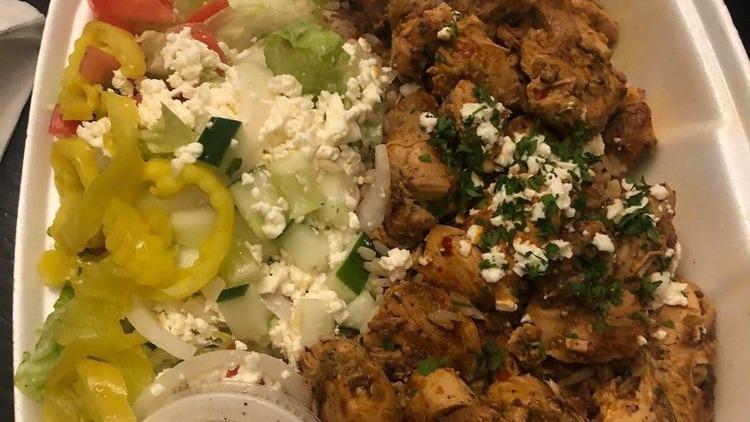 Grilled Chicken Gyro Bowl · A bed of our homemade Greek rice or mujadara (lentils and rice) topped with our fresh grilled chicken tenders, , feta cheese, onion, diced tomatoes, cucumber, lettuce and banana peppers served with our house Greek dressing and pita bread on the side.