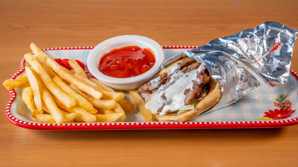Gyro · Gyro meat, onions, lettuce, tomatoes, and cucumber sauce.
