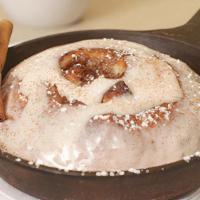 House-Made Cinnamon Roll · Croissant pastry dough filled with butter, brown sugar and cinnamon, baked in a. cast-iron s...