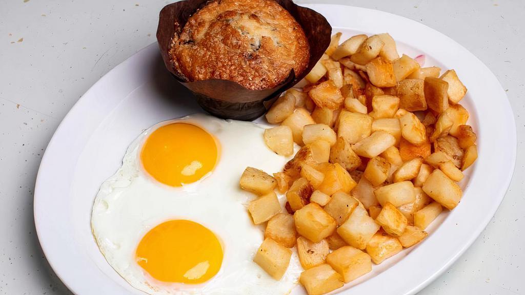 Zax I Am Fried Eggs And... · Two eggs any style with skillet potatoes and an Everything muffin