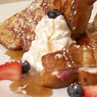 Stuffed French Toast · Thick-sliced sourdough, sweetened. cream cheese, blueberries, strawberries,. powdered sugar,...