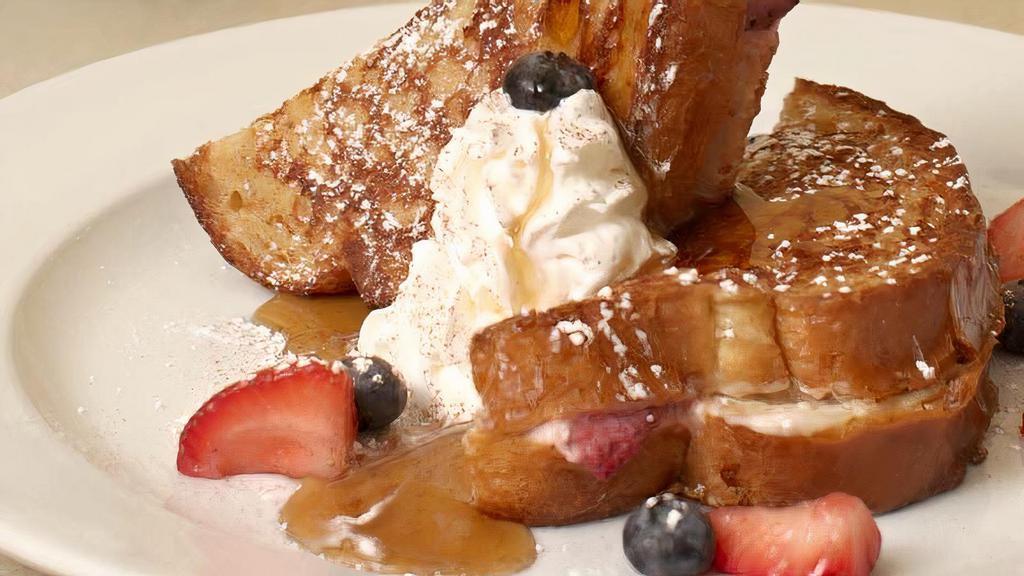 Stuffed French Toast · Thick-sliced sourdough, sweetened. cream cheese, blueberries, strawberries,. powdered sugar, cinnamon and. whipped cream