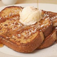 Classic French Toast · Thick-sliced sourdough dipped in. brandied egg batter with whipped. butter, maple syrup, pow...