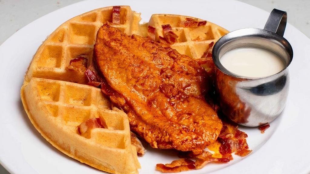 Chicken & Waffle · Chicken and Waffle. Seasoned chicken-infused waffle, Nashville. hot chicken breast, chopped bacon, and. house-made buttermilk maple syrup