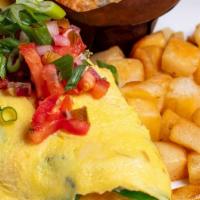 Wild Western Omelet · Ham, jalapeño peppers, onion, cheddar-jack cheese. Topped with. pico de gallo and green onio...