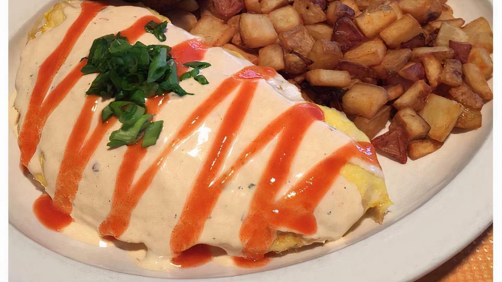 Buffalo Chicken Omelet · Pulled chicken breast, cream cheese and melted cheddar-jack. Topped with buffalo. ranch sauce and green onions