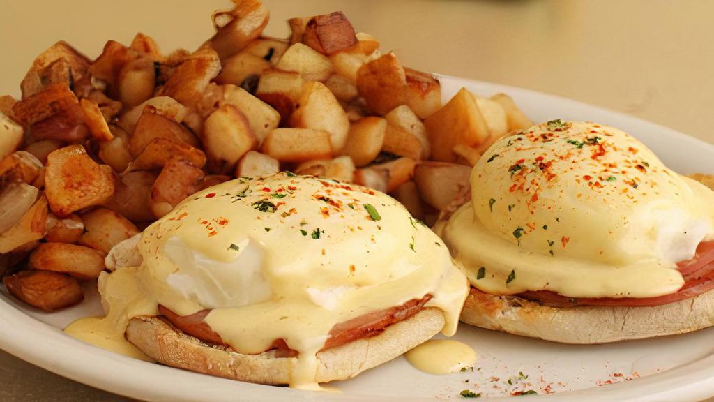 Eggs Bennie · Toasted English muffin, Canadian. bacon, poached eggs, fresh hollandaise. and smoked paprika. Served with your. choice of skillet potatoes or grits