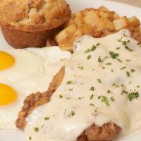Country Fried Steak · Hand-breaded sirloin topped with. white bacon gravy. Served with two. fried eggs, skillet po...