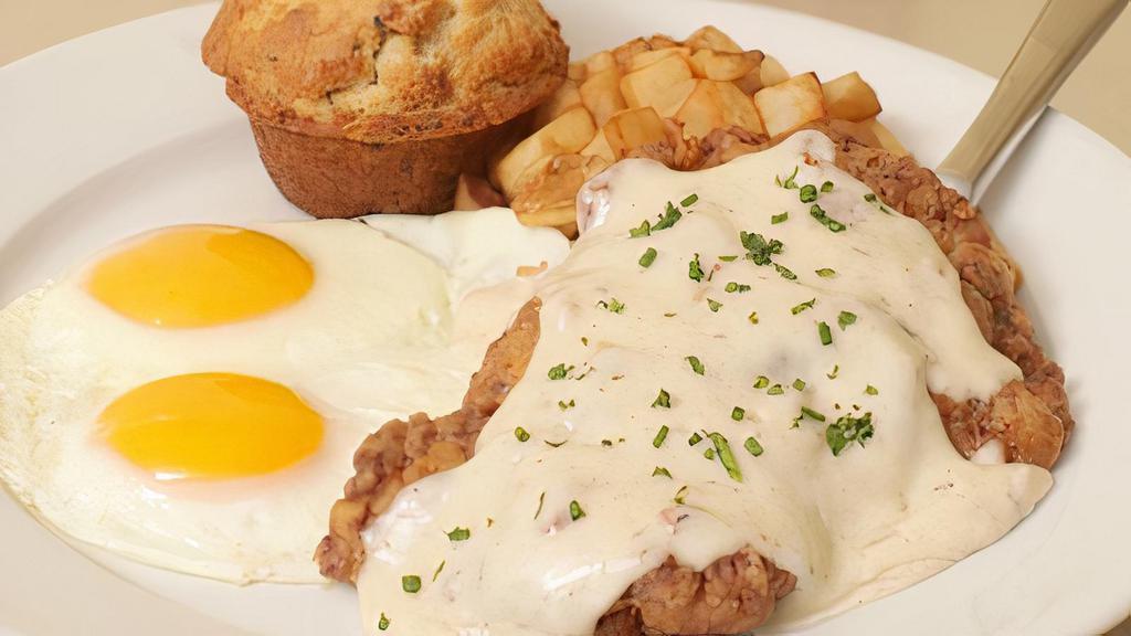 Country Fried Steak · Hand-breaded sirloin topped with. white bacon gravy. Served with two. fried eggs, skillet potatoes and an. Everything muffin