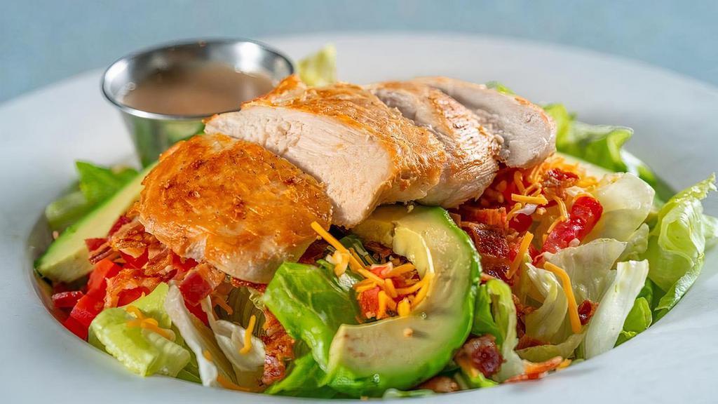 Grilled Chicken Salad · Fresh mixed greens topped with shredded cheese, tomatoes, eggs, avocado, onions, bacon and. fresh grilled chicken breast. Served with house-made balsamic vinaigrette