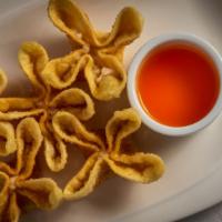 Fried Wontons · Crab rangoon. cream cheese and crab meat served with sauce.