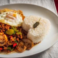 Pad-Ka-Pao · Jasmine rice red and green bell pepper mushroom and basil served with fried egg.