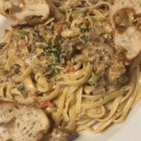 Cajun Brisket Fettuccine · Tender chunks of our house smoked Brisket along with mixed peppers and red onion in our hous...
